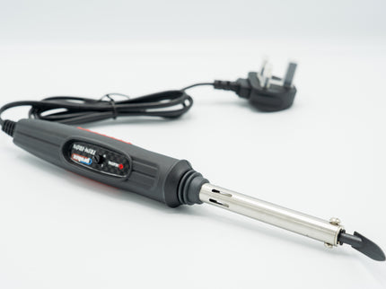 Soldering iron with a plug on a white background