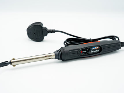 Soldering iron with a plug on a white background