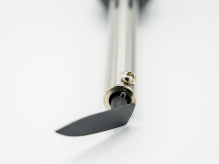 Close-up of a small knife with a metallic handle on a white background