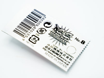 Product label with barcode and text on a white background