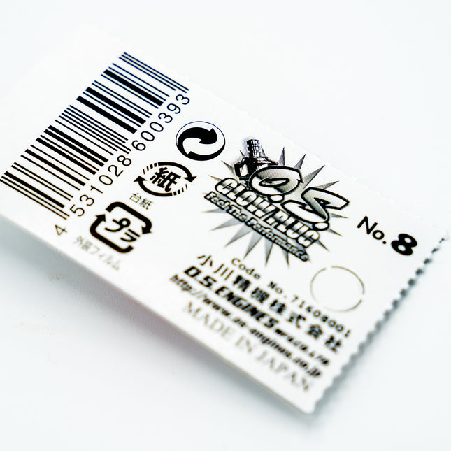 Product label with barcode and text on a white background