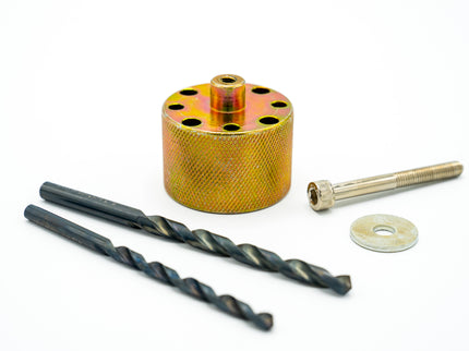 Drill bit set with a cylindrical metal component on a white background