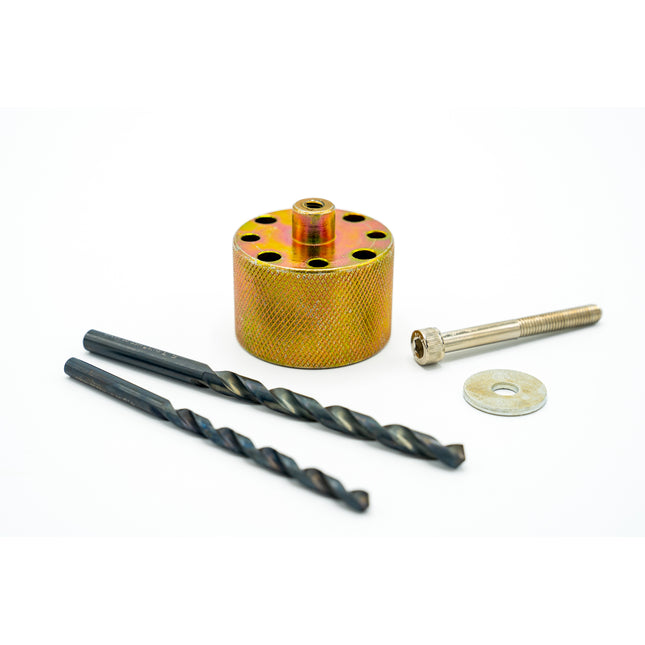 Drill bit set with a cylindrical metal component on a white background