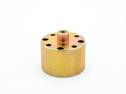 Gold metal component on a white background