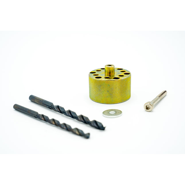 Set of drill bits and a metal cylindrical tool on a white background