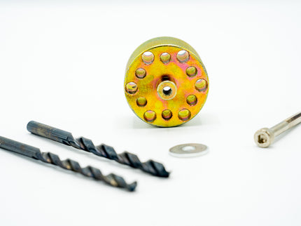Metal drill bit set with a yellow and gold drill bit on a white background