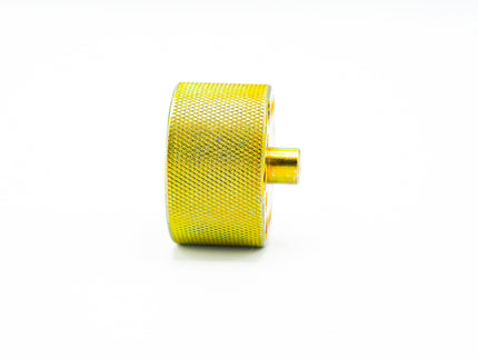 Gold textured wheel or gear on a white background