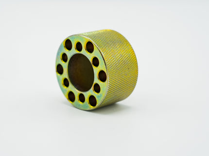 Yellow spool with black holes on a white background