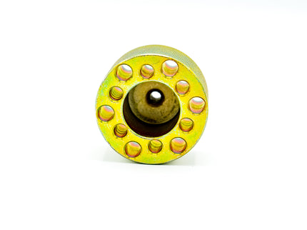 Yellow metal wheel with multiple holes on a white background