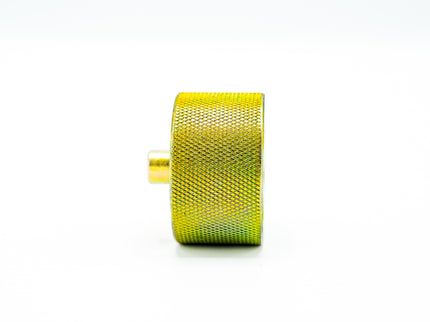 Yellow textured cylindrical object on a white background