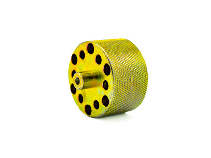 Yellow metal wheel with black holes on a white background