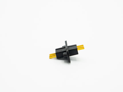 Small black and yellow mechanical component on a white background