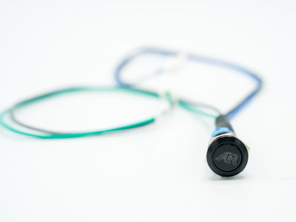 Close-up of a stethoscope with a visible brand logo on a white background