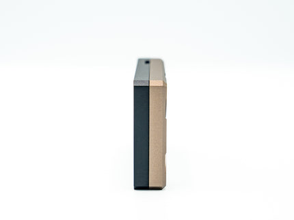 Two cylindrical objects with different color finishes on a white background