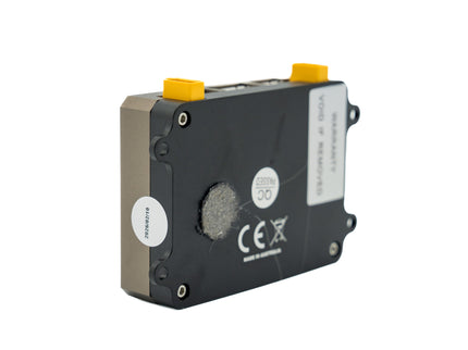Black ink cartridge with yellow top on a white background