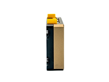 Close-up of a cylindrical product with a yellow cap on a white background