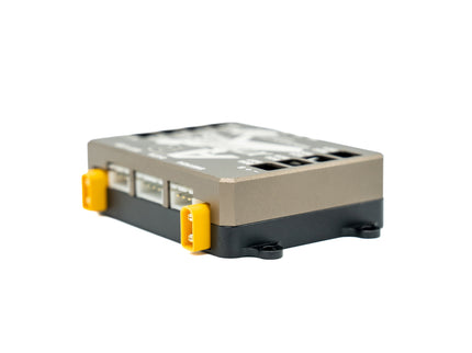 Small electronic device with a metallic finish on a white background