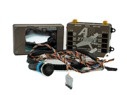 Automotive wiring harness with two electronic modules on a white background
