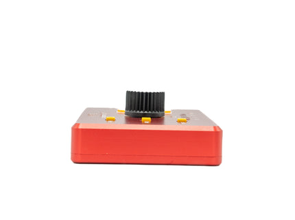 Red electronic device with a black component on a white background