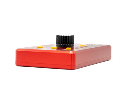 Red electronic device with a black knob on a white background