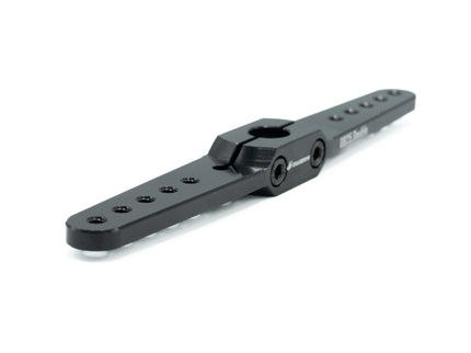 Black metal mechanical component on a white background