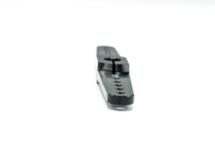 Metallic tool or component on a white background