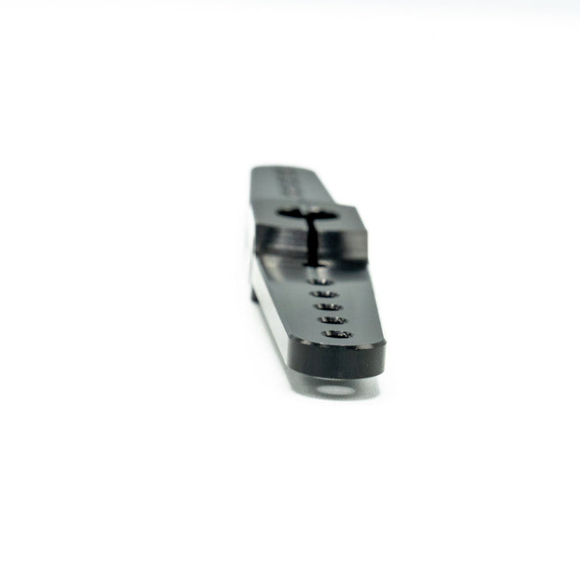 Metallic tool or component on a white background