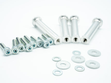Set of metal screws and washers on a white background