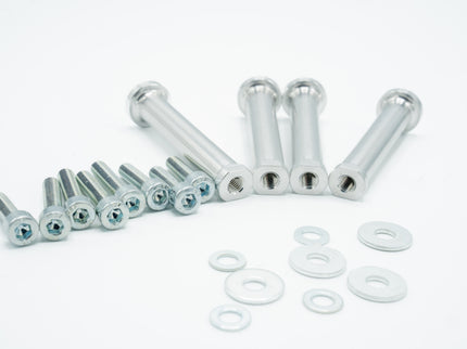 Set of metal screws and washers on a white background