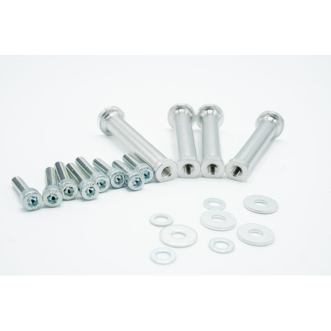 Set of metal screws and washers on a white background