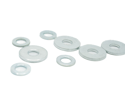 Set of white rubber washers on a white background
