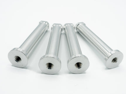 Five silver metal bolts on a white background