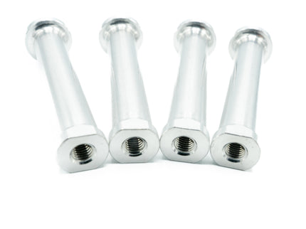 Four chrome metal bolts on a white background