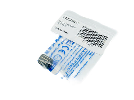Packaged medical needle with blue and white label on a white background
