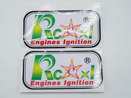 Two 'Rcexi Engines Ignition' stickers on a gray background