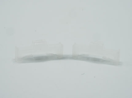 Clear glass container on a light gray background