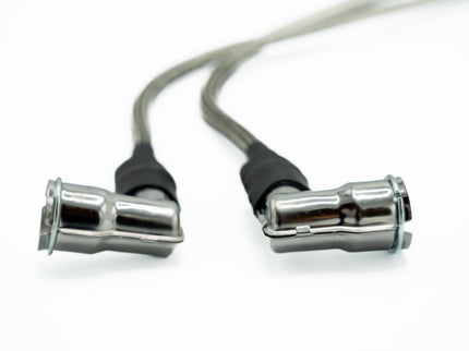 Close-up of a metal cable connector on a white background