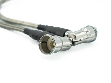 Coiled cable with metal connectors on a white background