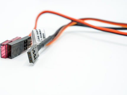 Electrical connectors with red and black wires on a white background