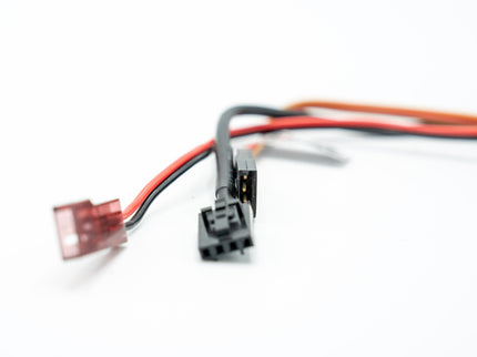 Electrical connector with red and black wires on a white background