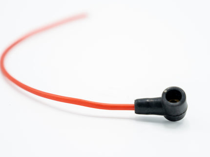 Red cable with black connector on a white background