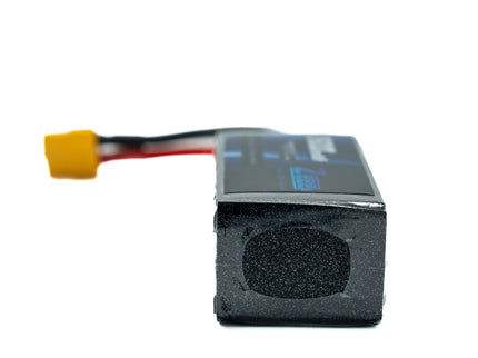 Black battery pack with yellow connector on a white background