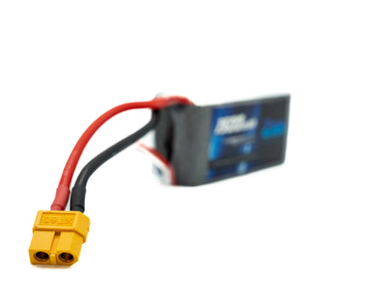 Battery with yellow connector on a white background