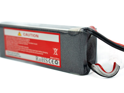Battery pack with red warning label on a white background