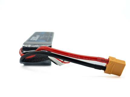 Battery pack with red and black cables and yellow connector on a white background