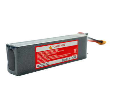 Battery pack with a red label on a white background