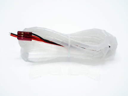 Clear plastic bag with a red and black cable on a white background