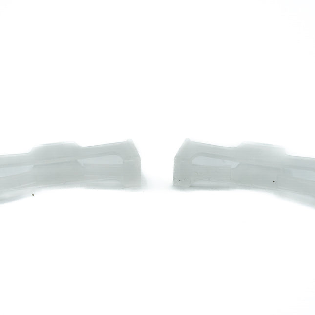 Two white plastic straps on a white background
