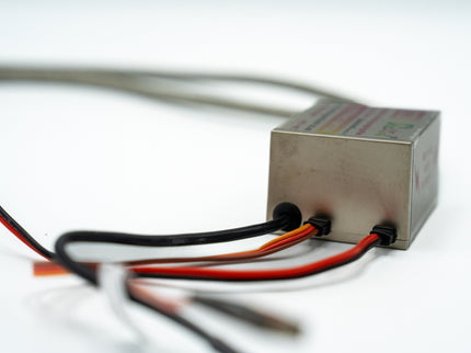 Rectangular electronic component with wires on a white background