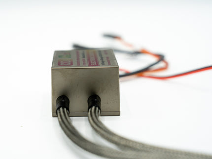 Rectangular metal component with wires on a white background